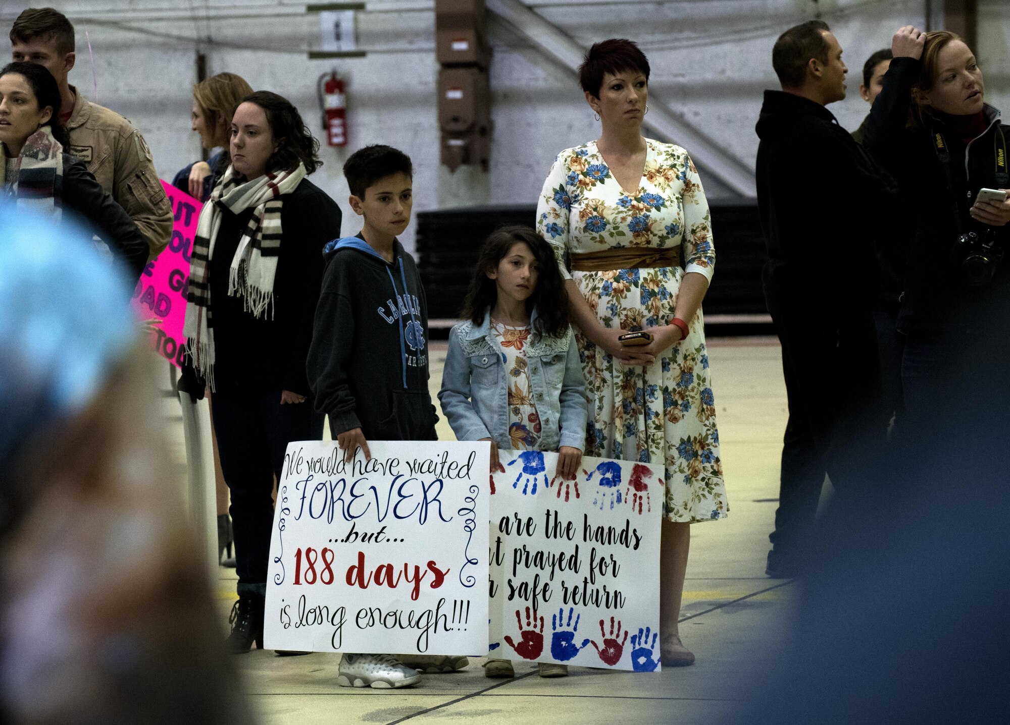Family members of Airmen assigned to the 480th Expeditionary Fighter Squadron await the squadron’s arrival back to Spangdahlem Air Base, Germany, Oct. 12, 2016. Friends and family members gathered at Hangar One to welcome home the 480th EFS, which deployed to Southwest Asia in support of Operation Inherent Resolve, whose mission aims to defeat enemy forces in the Combined Joint Force Area. (U.S. Air Force photo/Airman 1st Class Preston Cherry)