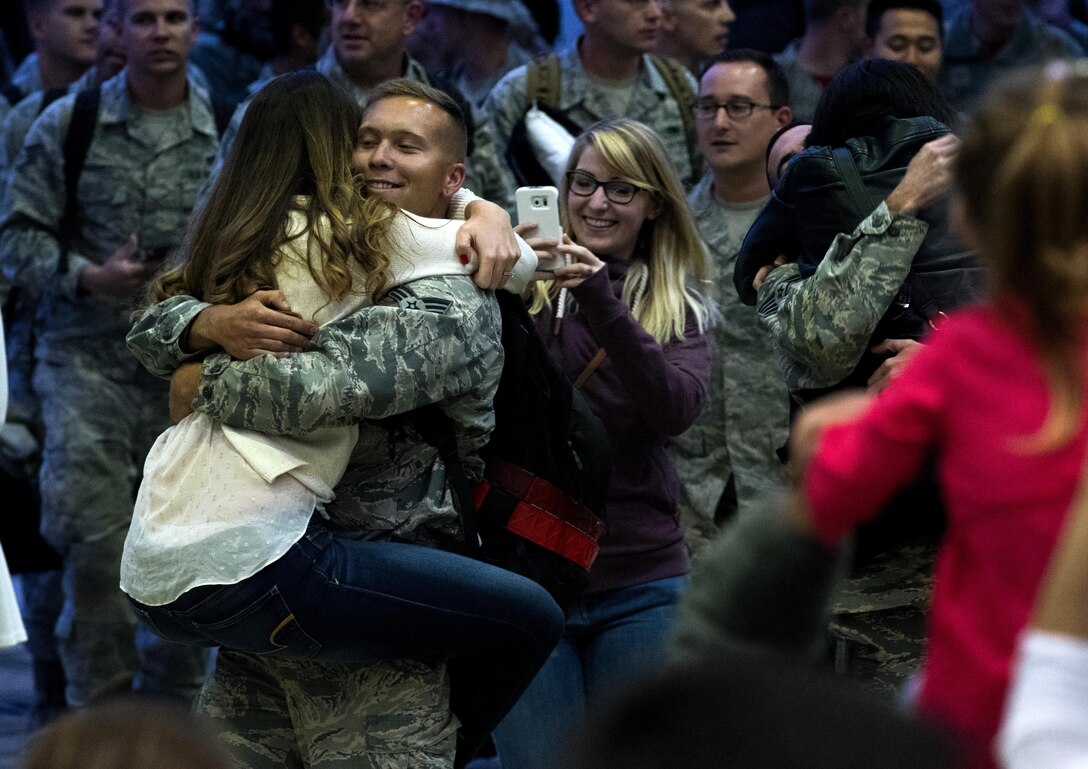 Airmen assigned to the 480th Expeditionary Fighter Squadron reunite with friends and family during the squadron’s return to Spangdahlem Air Base, Germany, Oct. 12, 2016. Approximately 300 squadron members arrived from a six-month deployment in Southwest Asia where they provided close air support and dynamic targeting operations in support of Operation Inherent Resolve. (U.S. Air Force photo/Airman 1st Class Preston Cherry)