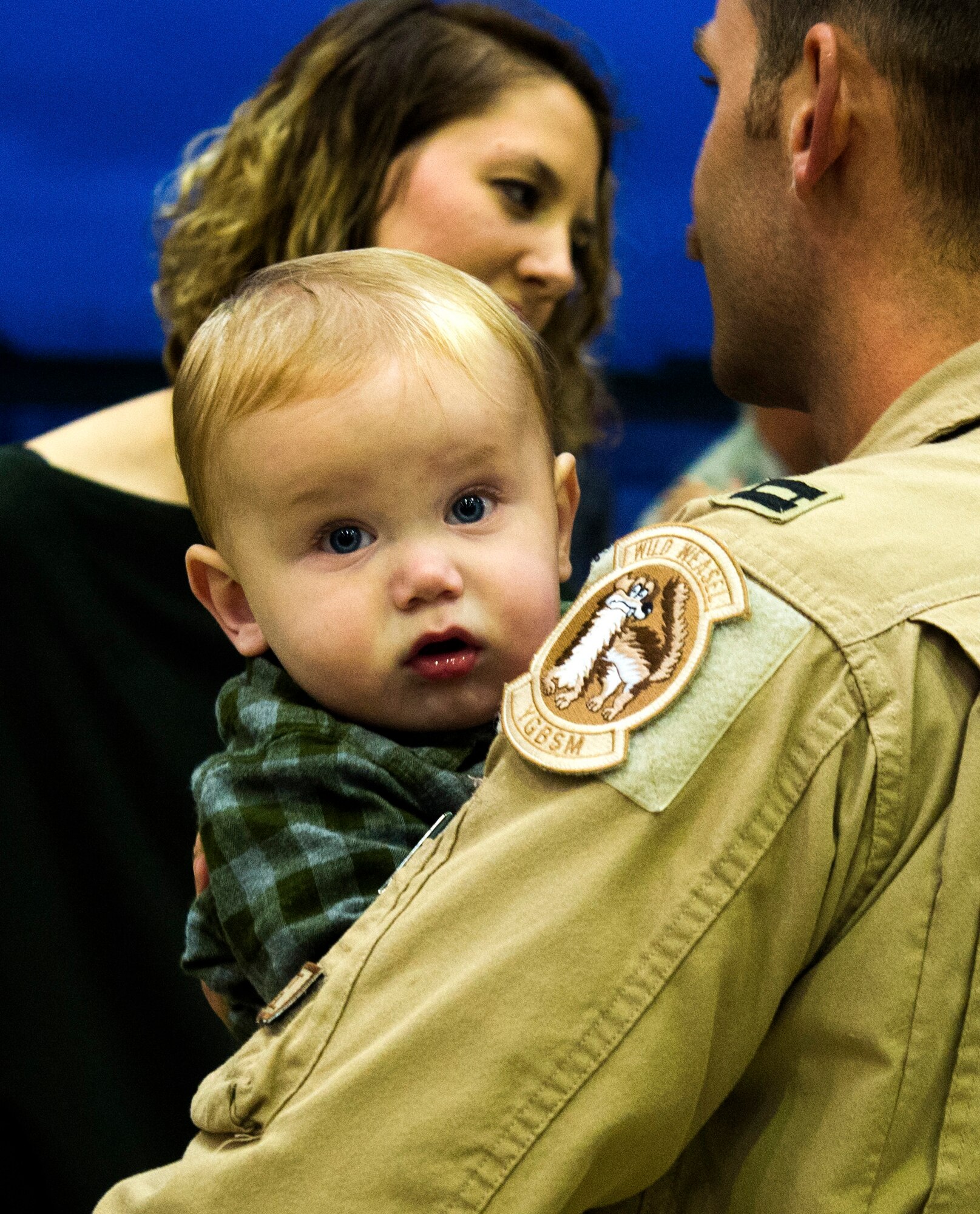 An Airman from the 480th Expeditionary Fighter Squadron holds his son after returning to Spangdahlem Air Base, Germany, Oct. 12, 2016. The squadron completed a six-month deployment to Southwest Asia to support Operation Inherent Resolve, which aims to defeat enemy forces in the Combined Joint Force Area. (U.S. Air Force photo/Airman 1st Class Preston Cherry)