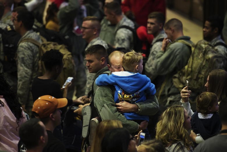 An Airman reunites with his son during the 480th Expeditionary Fighter Squadron return from Southwest Asia to Spangdahlem Air Base, Germany, Oct. 12, 2016. The 480th EFS deployed in support of Operation Inherent
Resolve’s, which aims to militarily defeat enemy forces in the Combined Joint Operations Area by, with and through
regional partners in order to enable whole-of-governmental actions to increase regional stability by conducting a
campaign against enemy forces in Iraq and Syria. (U.S. Air Force photo by Staff Sgt. Jonathan Snyder)