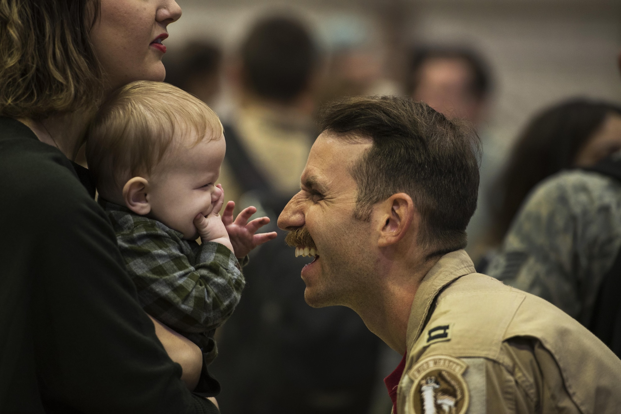 An Airman assigned to the 480th Expeditionary Fighter Squadron reunite with his family during the squadron’s
return to Spangdahlem Air Base, Germany, Oct. 12, 2016. Approximately 300 of the squadron’s Airmen, who serve
in flight, maintenance or support roles for the F-16 Fighting Falcon fighter aircraft, completed a six-month
deployment to Southwest Asia by providing close air support and dynamic targeting operations in support of
Operation Inherent Resolve. (U.S. Air Force photo by Staff Sgt. Jonathan Snyder)