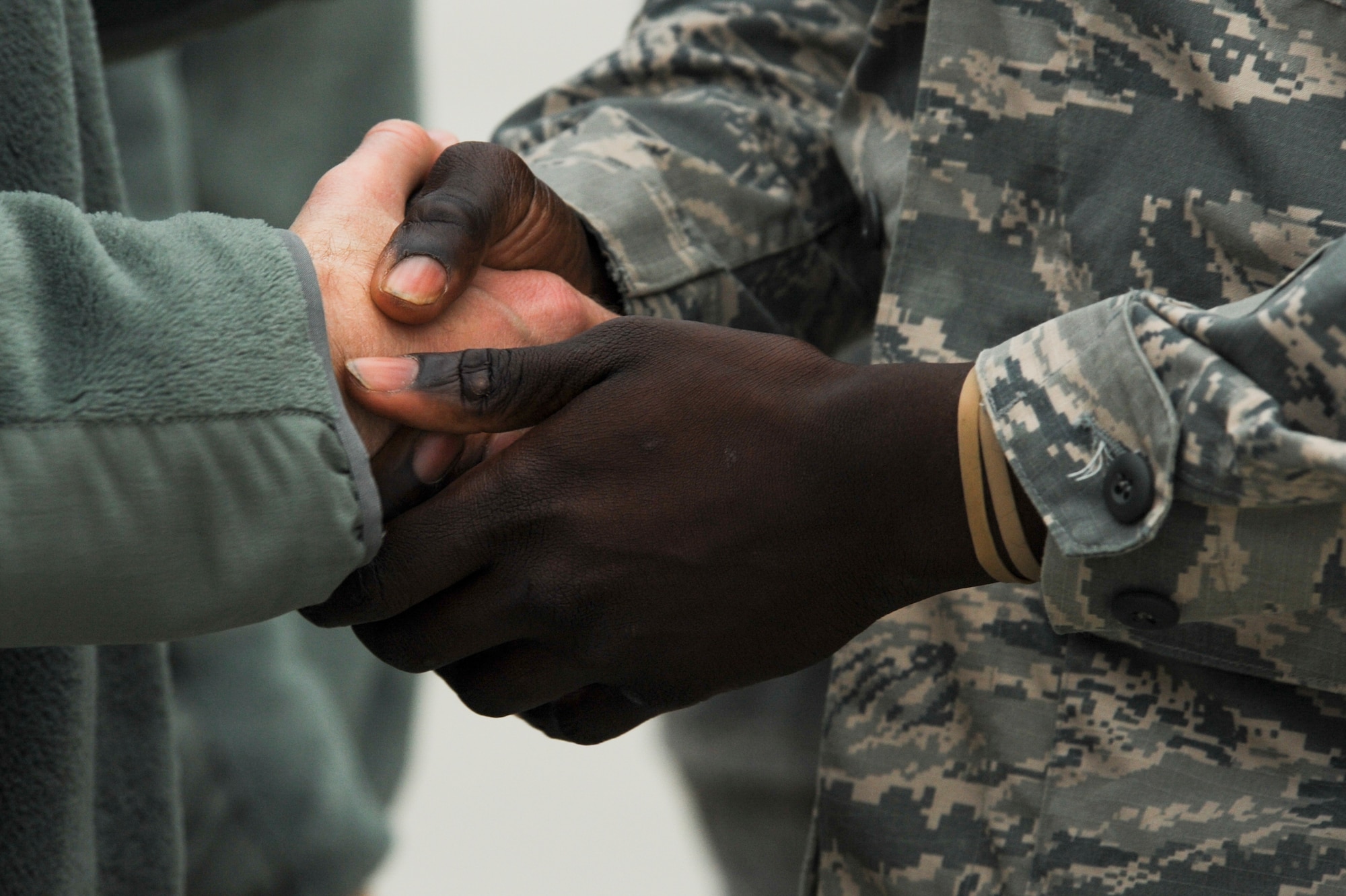Chief Master Sgt. Edwin Ludwigsen, 52nd Fighter Wing command chief, left, shakes the hand of an Airman assigned to the 480th Expeditionary Fighter Squadron, right, during the squadron’s return to Spangdahlem Air Base, Germany, Oct. 12, 2016. Approximately 300 of the Airmen, who serve in flight, maintenance or support roles for the F-16 Fighting Falcon fighter aircraft, completed a six-month deployment to Southwest Asia by providing close air support and dynamic targeting operations as part of the squadron’s first deployment in support of Operation Inherent Resolve. Operation Inherent Resolve aims to eliminate the Da'esh terrorist group and the threat they pose to Iraq, Syria and the wider international community. (U.S. Air Force photo by Staff Sgt. Joe W. McFadden)