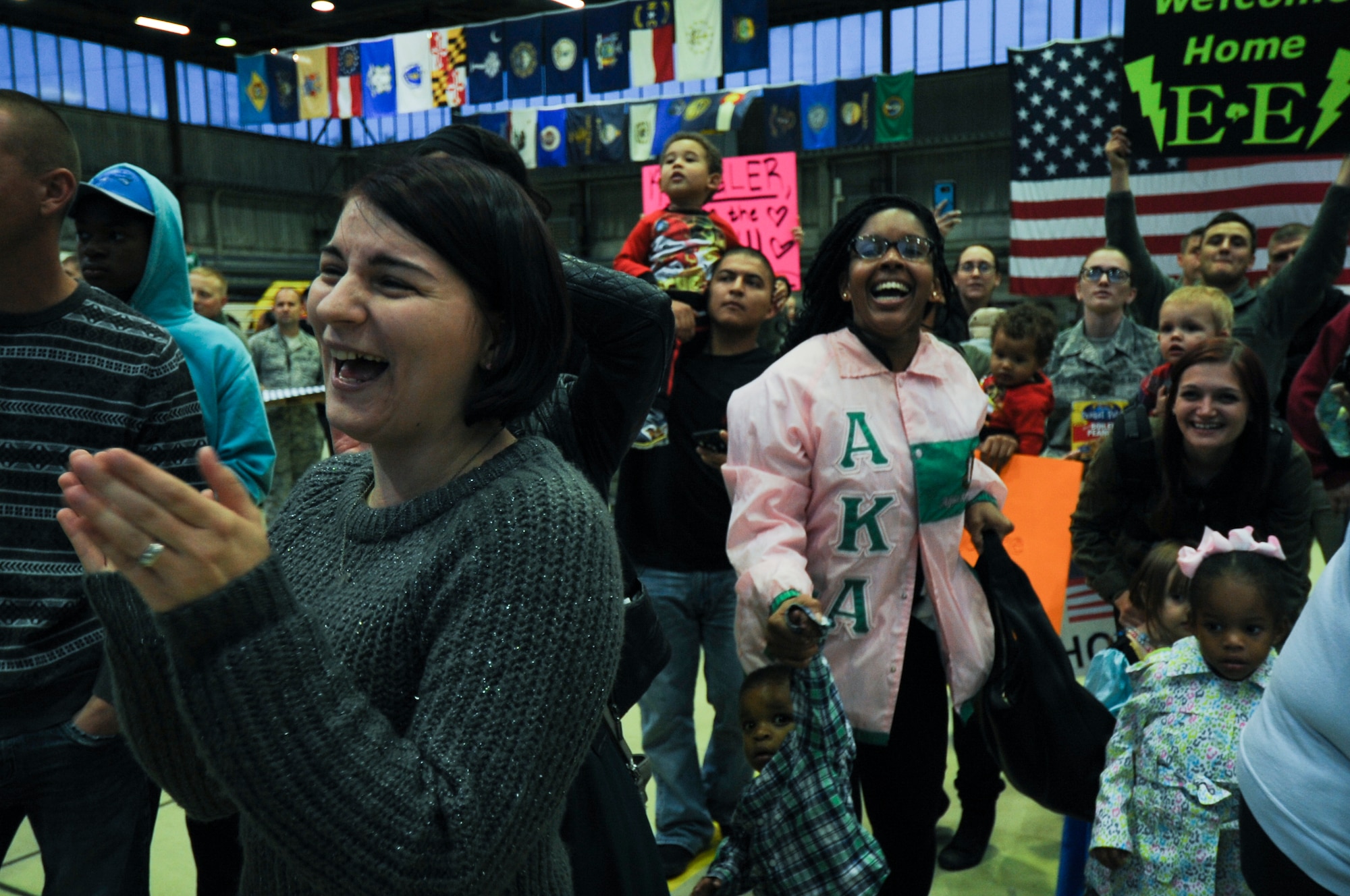 Family members cheer as Airmen assigned to the 480th Expeditionary Fighter Squadron arrive during the squadron’s return to Spangdahlem Air Base, Germany, Oct. 12, 2016. Approximately 300 of the Airmen, who serve in flight, maintenance or support roles for the F-16 Fighting Falcon fighter aircraft, completed a six-month deployment to Southwest Asia by providing close air support and dynamic targeting operations as part of the squadron’s first deployment in support of Operation Inherent Resolve. Operation Inherent Resolve aims to eliminate the Da'esh terrorist group and the threat they pose to Iraq, Syria and the wider international community. (U.S. Air Force photo by Staff Sgt. Joe W. McFadden)