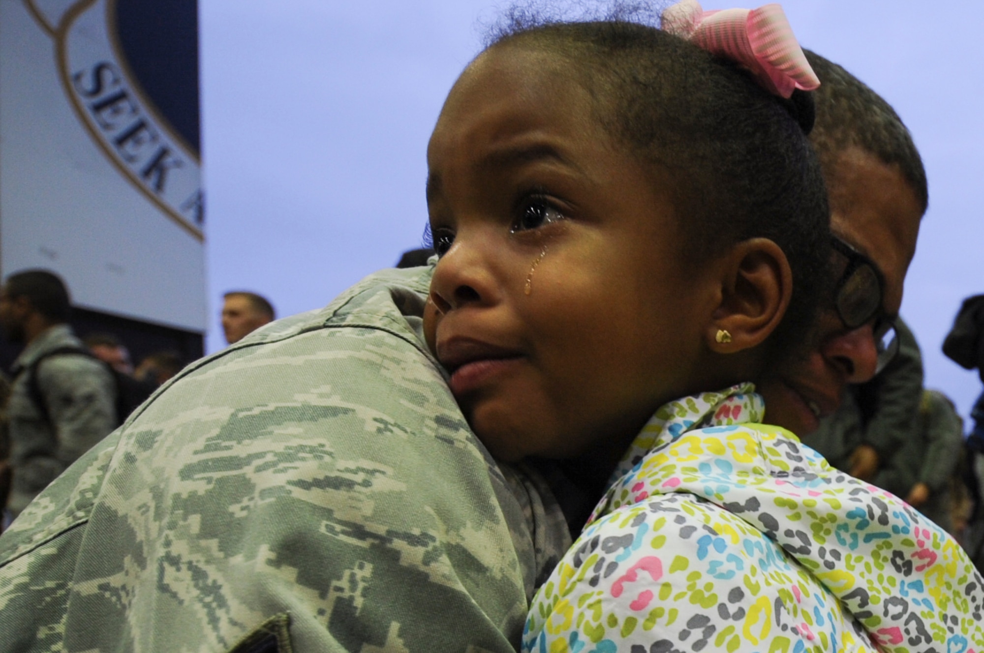 An Airman assigned to the 480th Expeditionary Fighter Squadron holds his daughter during the squadron’s return to Spangdahlem Air Base, Germany, Oct. 12, 2016. Approximately 300 of the Airmen, who serve in flight, maintenance or support roles for the F-16 Fighting Falcon fighter aircraft, completed a six-month deployment to Southwest Asia by providing close air support and dynamic targeting operations as part of the squadron’s first deployment in support of Operation Inherent Resolve. Operation Inherent Resolve aims to eliminate the Da'esh terrorist group and the threat they pose to Iraq, Syria and the wider international community. (U.S. Air Force photo by Staff Sgt. Joe W. McFadden)