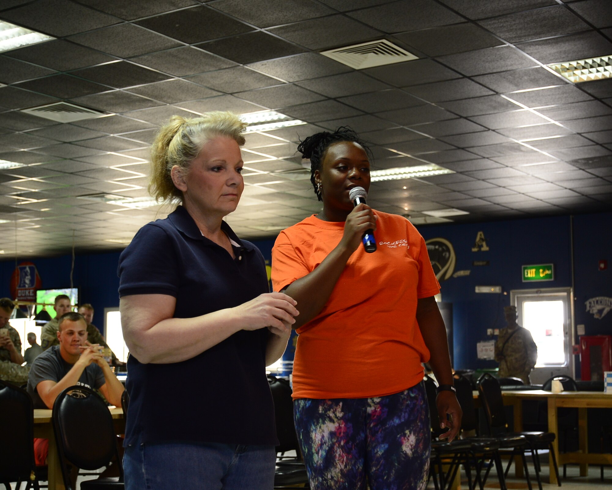 Col. Mary Gardner, 386th Expeditionary Mission Support Group deputy commander, left, plays a game of deal or no deal as SSgt. Candace Leslie, 386th Expeditionary Force Support Squadron Drop Zone representative, hosts the game Oct. 8, 2016 at an undisclosed location in Southwest Asia. The game was a part of Rockfest XV, which gave Airmen at the Rock a day of fun events to celebrate the midway point of most of their deployments. (U.S. Air Force photo/Capt. Casey Osborne)