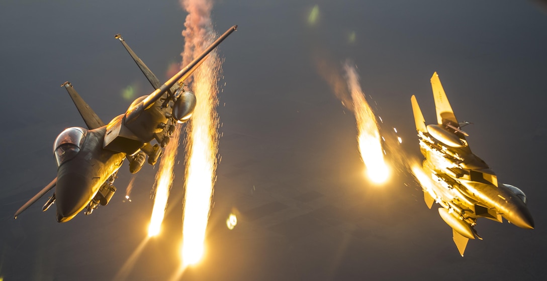 Two F-15 Eagles drop flares after receiving fuel from a KC-135 Stratotanker  over Iraq in support of Operation Inherent Resolve July 8, 2016. The KC-135 provides the core aerial refueling capability for the U.S. Air Force and has excelled in this role for more than 50 years. (U.S. Air Force photo by Staff Sgt. Douglas Ellis/Released)