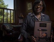Jenean Hampton, Commonwealth of Kentucky Lieutenant Governor, reviews documents during an Air Force Veterans in Blue shoot, August 2, 2016, at Frankfort, KY. Lt. Governor Hampton served seven years in the Air Force as a computer systems officer, writing computer code and testing software. During her military service she was stationed in San Antonio, Texas, Oklahoma City, OK, and was deployed to Operation Desert Storm in Saudi Arabia. (U.S. Air Force photo/Staff Sgt. DeAndre Curtiss)