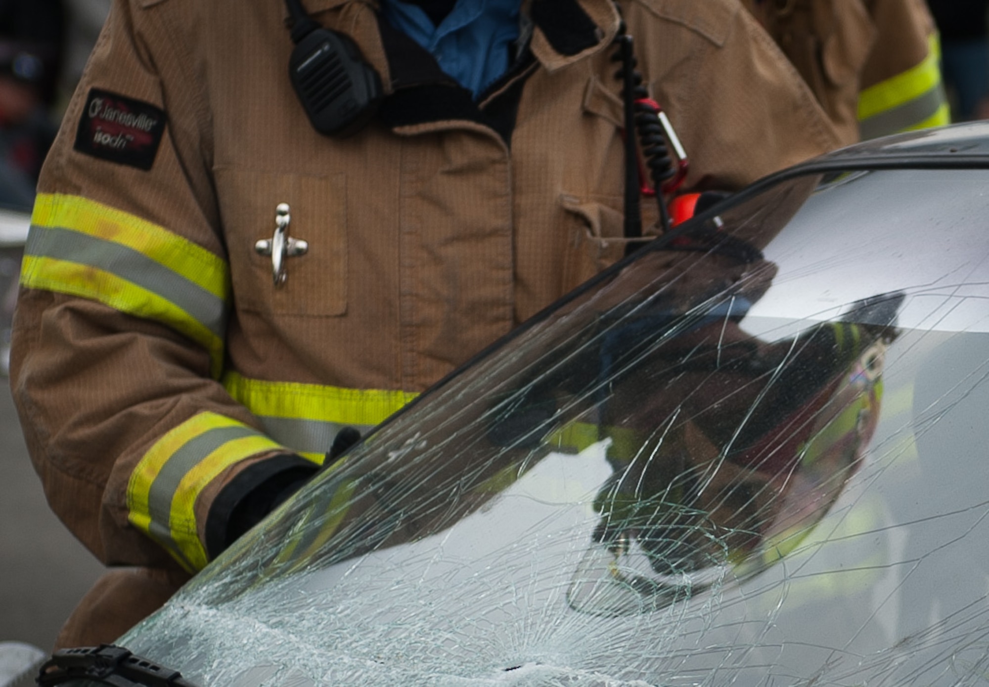 A firefighter assigned to the 786th Civil Engineer Squadron performs a vehicle extrication during an open house event training exercise Oct. 8, 2016, at Ramstein Air Base, Germany. Vehicle extrication is the process of removing a vehicle from around a person who has been involved in a motor vehicle accident, when conventional means of exit are impossible or inadvisable. (U.S. Air Force photo by Airman 1st Class Lane T. Plummer)