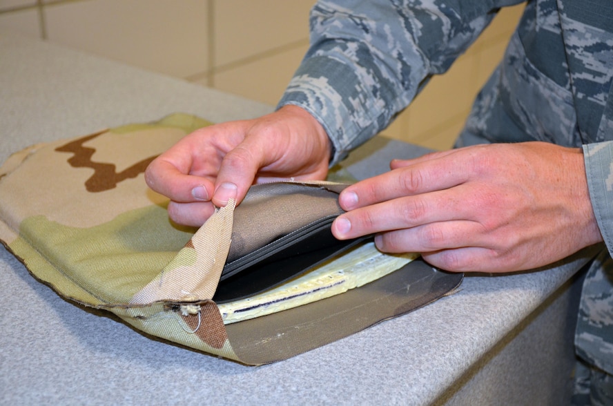 A new type of flexible body armor developed through a collaboration between the Air Force and Naval Research Laboratories is 50 percent lighter than current body armor. The design makes the use of a ceramic ball matrix encapsulated in foam material, which is then backed with multiple layers of polyethylene sheets. (U.S. Air Force photo by Marisa Novobilski/released)