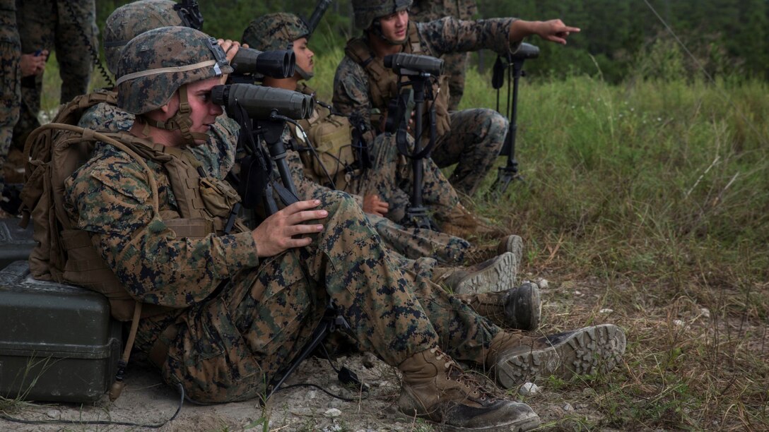 U.S. Marines with Weapons Company, 1st Battalion, 2nd Marine Regiment, observe 81mm mortar targets at a live-fire range at Marine Corps Base Camp Lejeune, N.C., Sept. 29, 2016. With the help of forward observers and coordination tools, the motivated mortar men locked on targets and accurately disbursed rounds down range.