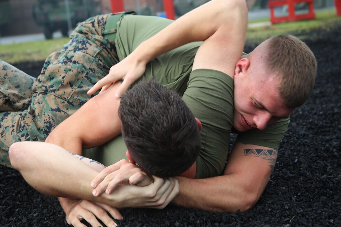 Lance Cpl. David Sigdestad spars with Sgt. James Metzgar during a Marine Corps Martial Arts training session aboard Marine Corps Air Station Cherry Point, N.C., Oct. 4, 2016. Despite only being at his current unit for six short months, Sigdestad makes the most out of every moment no matter if he is working hard in a field operation or sparring in MCMAP. Sigdestad and Metzgar are data systems specialists with Marine Wing Communications Squadron 28, 2nd Marine Aircraft Wing. (U.S. Marine Corps photo by Lance Cpl. Mackenzie Gibson/Released)