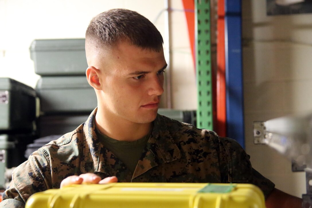 Lance Cpl. David Sigdestad moves data systems equipment in a warehouse aboard Marine Corps Air Station Cherry Point, N.C., Oct. 4, 2016. Despite only being at his current unit for six short months, Sigdestad makes the most out of every moment no matter if he is working hard in a field operation or sparring in a martial arts session. Sigdestad is a data systems specialist with Marine Wing Communications Squadron 28, 2nd Marine Aircraft Wing. (U.S. Marine Corps photo by Lance Cpl. Mackenzie Gibson/Released)