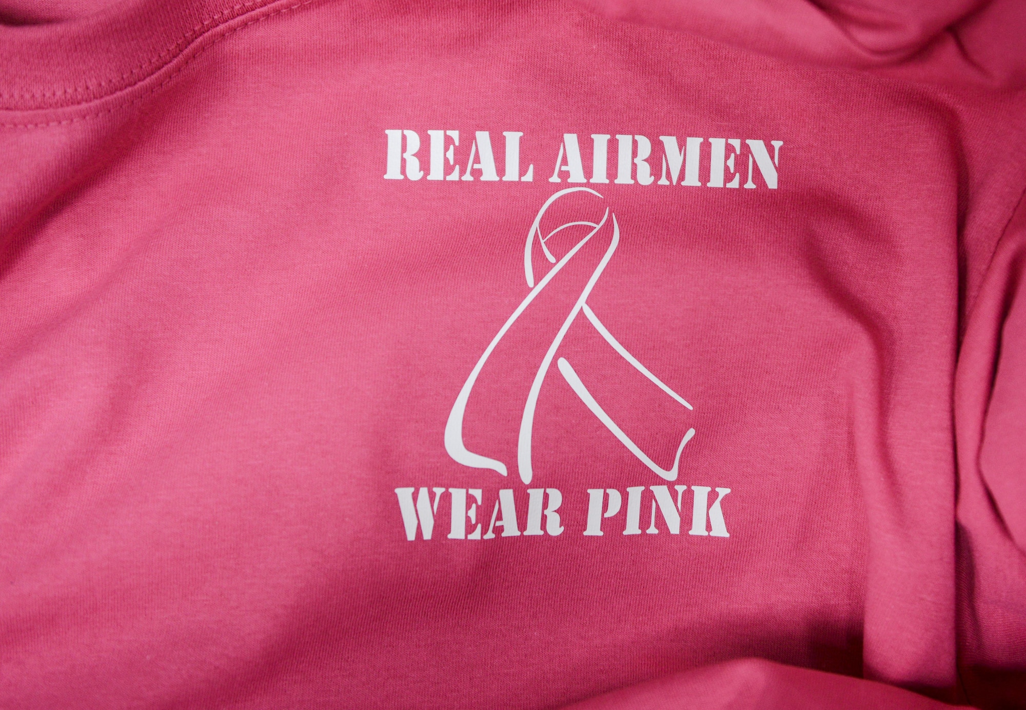 A pink morale shirt of the 86th Medical Group is displayed in a box at Ramstein Air Base, Germany, Oct. 6, 2016. The 86th MDG is using the color pink for its morale shirts in observance of Breast Cancer Awareness Month. (U.S. Air Force photo by Airman 1st Class Joshua Magbanua)