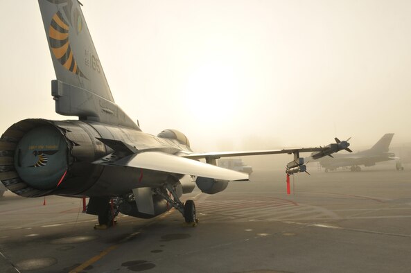 An F-16 Fighting Falcon sits on the ramp at Toledo Air National Guard Base, Ohio, prior to a morning sortie Oct. 4, 2016. Routine training missions allow the 180th Fighter Wing to remain an agile responder in times of crisis, contingency and conflict. (U.S. Air National Guard photo/Senior Airman Hannah Ortloff)