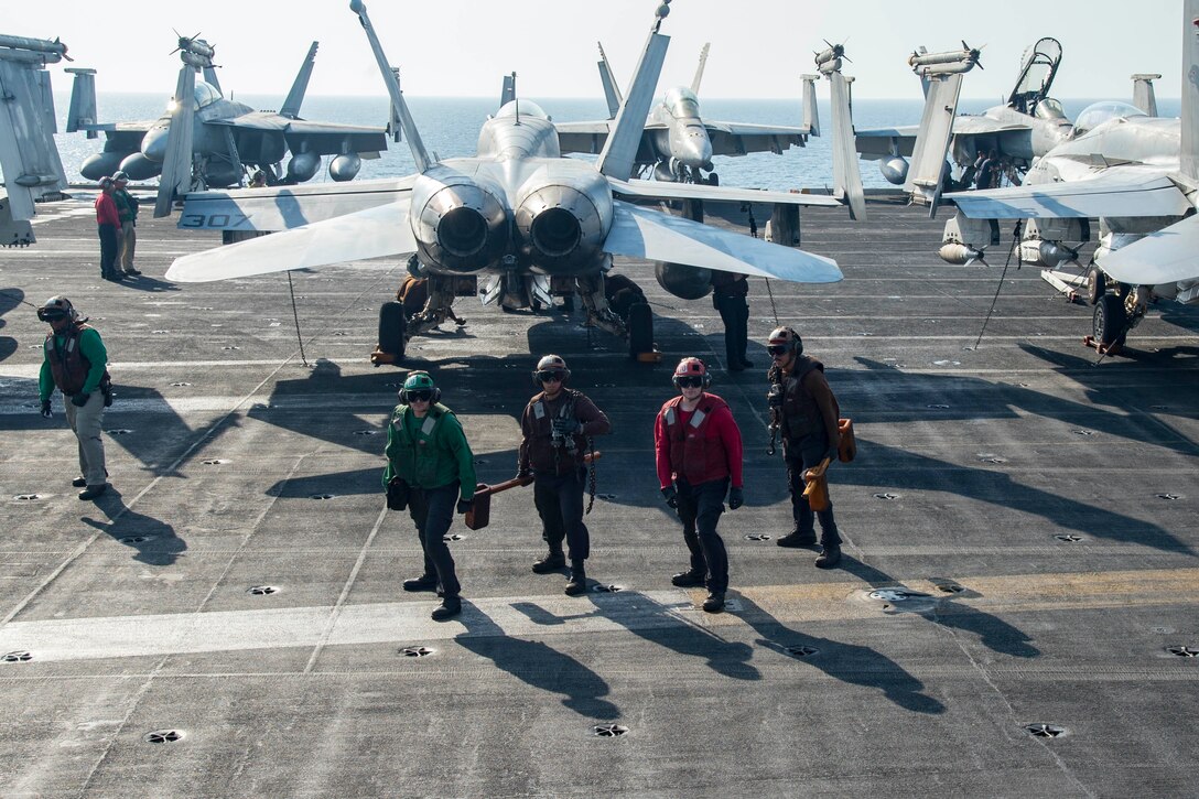 161012-N-TV337-019

ARABIAN GULF (Oct. 12, 2016) Sailors brace themselves against propeller wash as a MH-60S Sea Hawk helicopter assigned to the Dusty Dogs of Helicopter Sea Combat Squadron (HSC) 7 lands on the flight deck of the aircraft carrier USS Dwight D. Eisenhower (CVN 69) (Ike). Ike and its Carrier Strike Group are deployed in support of Operation Inherent Resolve, maritime security operations and theater security cooperation efforts in the U.S. 5th Fleet area of operations. (U.S. Navy photo by Petty Officer 3rd Class Robert J. Baldock)