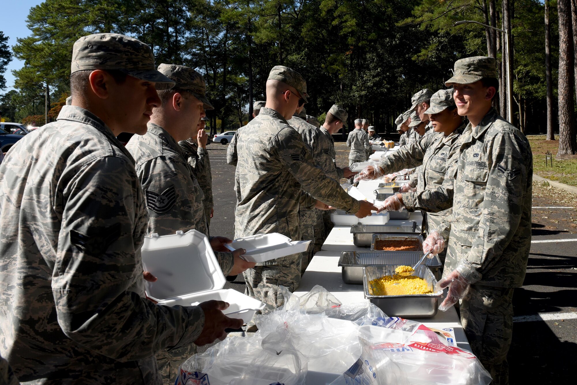 Members of Team Seymour prepare hot meals for families affected by Hurricane Matthew, Oct. 12, 2016, at Seymour Johnson Air Force Base, North Carolina. Airmen and local volunteers were able to deliver more than 400 meals on base and more than 100 meals off base to emergency responders. 