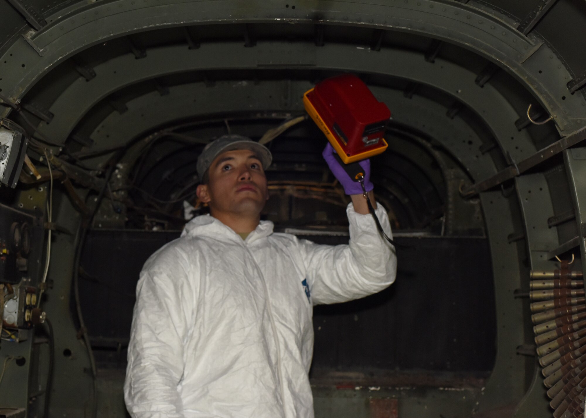 Senior Airman Eugenio Aquino-Aguilar, 341st Medical Operations Squadron bioenvironmental team, uses a Geiger counter in the interior of a decommissioned B-25 Mitchell bomber to measure levels of radiation inside the aircraft Oct. 12, 2016, at Malmstrom Air Force Base, Mont.  Aguilar ensures the alpha and gamma levels in the aircraft are considered safe to visit at the base museum air park.  (U.S. Air Force photo/Jason Heavner)
