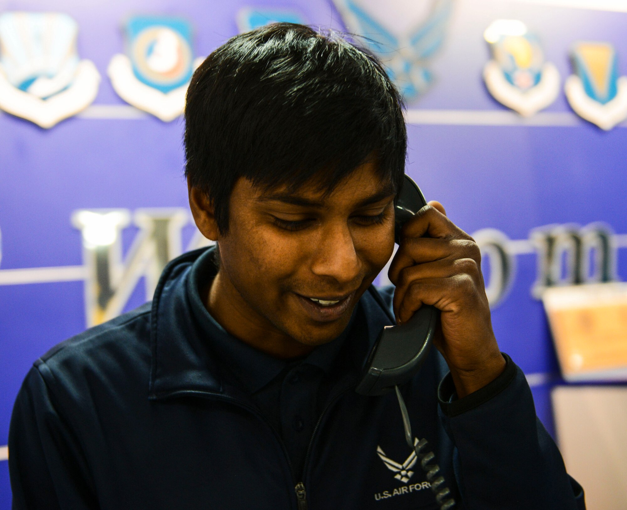 Victor Trey, 786th Force Support Squadron recreation assistant, answers a phone call at the Southside Fitness Center at Ramstein Air Base, Germany, Oct. 6, 2016. Airmen at Ramstein can call the SSFC to schedule physical training sessions, PT tests or inquire about fitness classes. (U.S. Air Force photo by Airman 1st Class Joshua Magbanua)