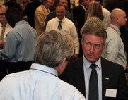 Ronald Schumann, ILSI Engineering vice president of engineering and technical services, speaks with memebers of Huntsville Center's Automated Systems Branch during the Center's 17th Annual Small Business Forum Oct. 12. The event provides an opportunity for small business representatives to discuss their capabilities with Huntsville Center contracting officials and program managers to learn about upcoming Huntsville Center acquisitions. 