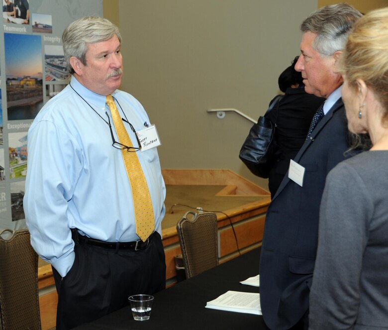 Garry Runyans, Huntsville Ceter Automated Systems Branch chief, speaks with small business representatives during the Hun tsville Center's 17th Annual Small Business Forum Oct. 12 at the Jackson Center at Cummings Research Park.The event provides an opportunity for small business representatives to discuss their capabilities with Huntsville Center contracting officials and program managers to learn about upcoming Huntsville Center acquisitions. 