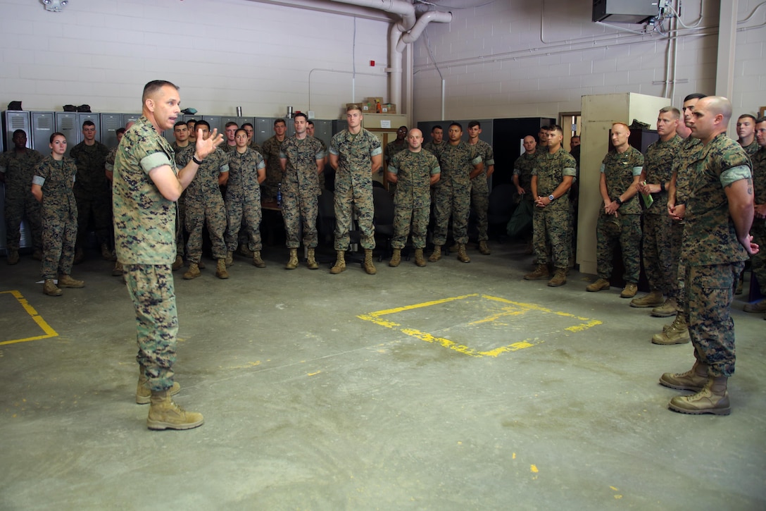 Brig. Gen. Matthew Glavy visits Marines with Marine Wing Support Detachment 31 aboard Marine Corps Air Station Beaufort, S.C., Oct. 14, 2016. Glavy visited the air station to assess the effects of Hurricane Matthew and attend the Marine Fighter Attack Squadron 122 change of command ceremony. Glavy issued the Navy and Marine Corps Achievement Medal to Capt. Seve Aguinaga and commended all the Marines there for their tremendous efforts in preparing and responding to the storm, noting they “were fighting outside of their weight class” after conducting operations normally expected of larger support squadrons to minimize impacts of the hurricane. (U.S. Marine Corps photos by Lance Cpl. Mackenzie Gibson/Released)