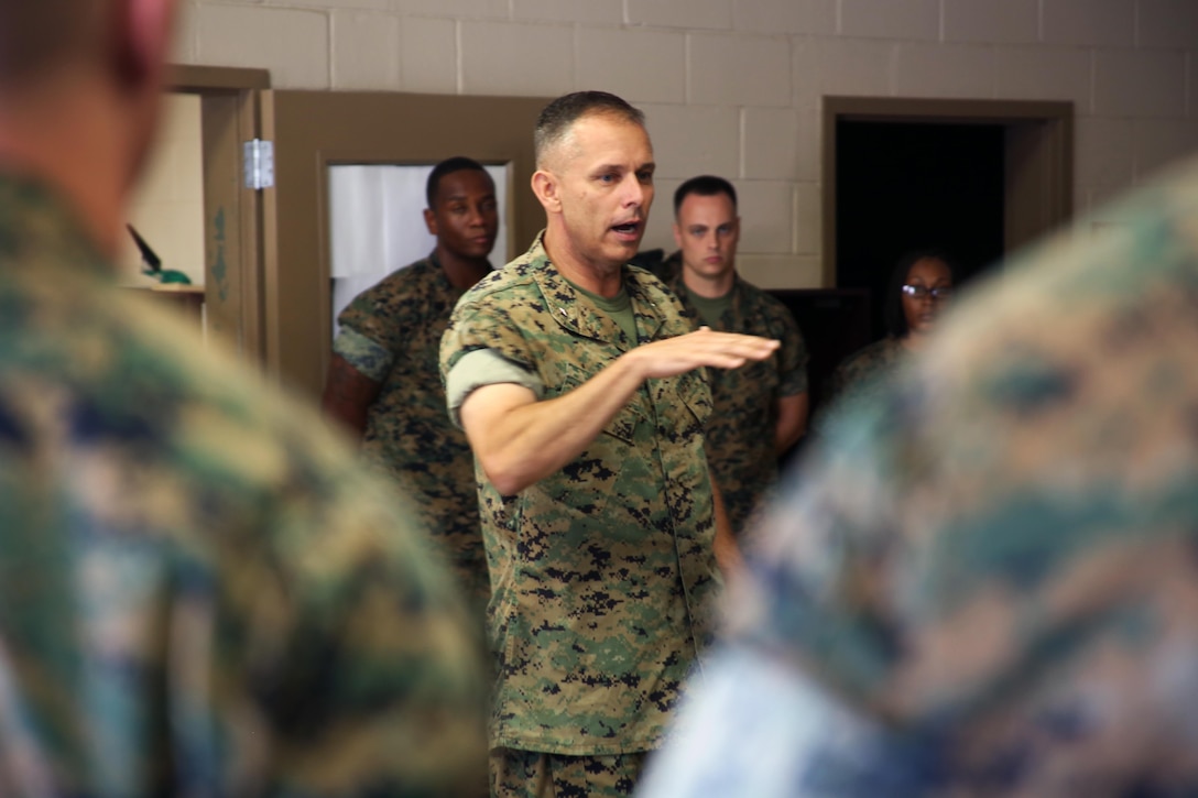 Brig. Gen. Matthew Glavy visits Marines with Marine Wing Support Detachment 31 aboard Marine Corps Air Station Beaufort, S.C., Oct. 14, 2016. Glavy visited the air station to assess the effects of Hurricane Matthew and attend the Marine Fighter Attack Squadron 122 change of command ceremony. Glavy issued the Navy and Marine Corps Achievement Medal to Capt. Seve Aguinaga and commended all the Marines there for their tremendous efforts in preparing and responding to the storm, noting they “were fighting outside of their weight class” after conducting operations normally expected of larger support squadrons to minimize impacts of the hurricane. (U.S. Marine Corps photos by Lance Cpl. Mackenzie Gibson/Released)