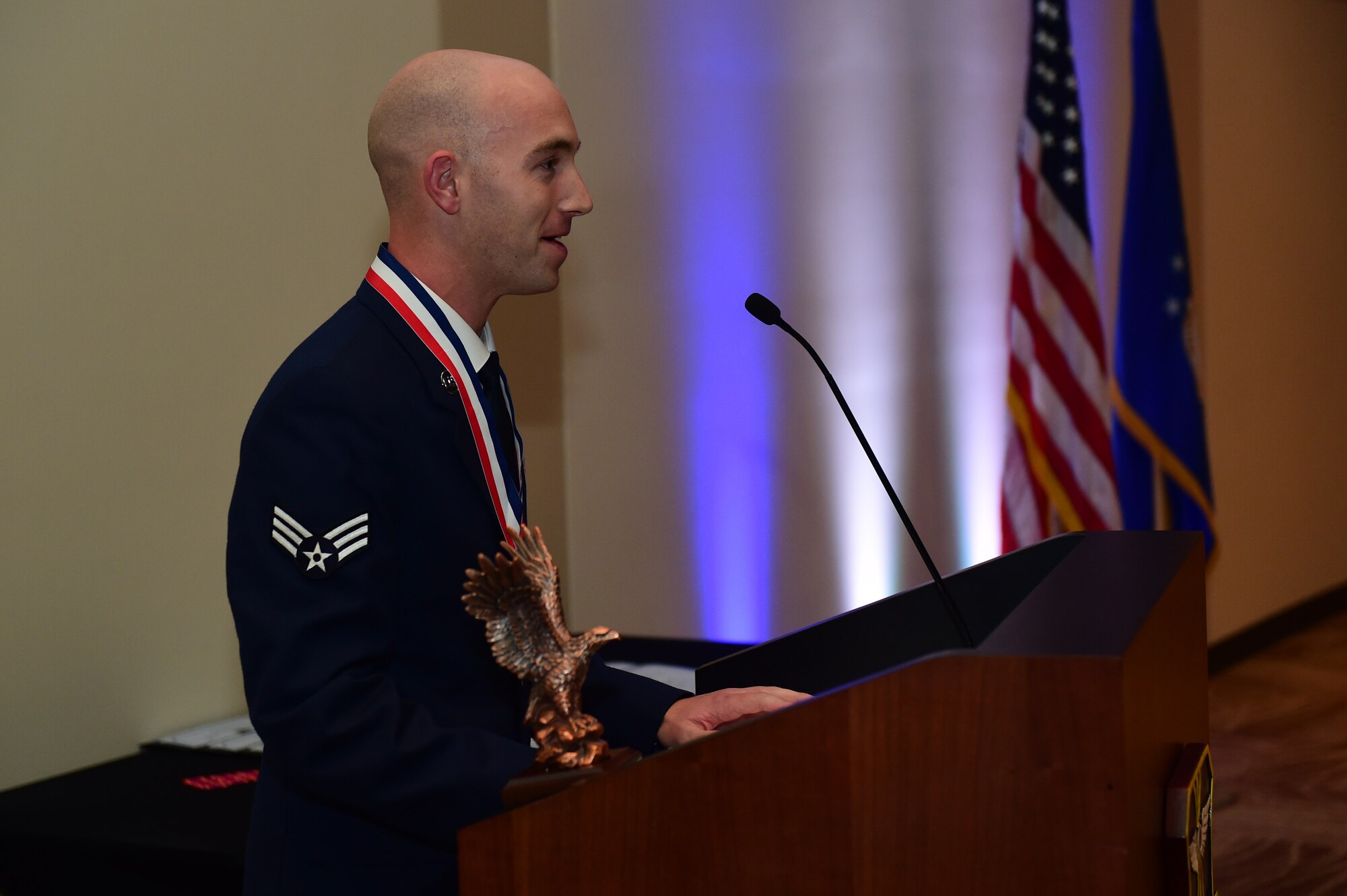 Senior Airman Alexander Nelson, John L. Levitow recipient, speaks during an Airman Leadership School graduation Oct. 13, 2016, at the Leadership Development Center on Buckley Air Force Base, Colo. John L. Levitow is the lowest ranking Airman to earn the Medal of Honor in 1969 during the Vietnam War. Nelson is assigned to the Aerospace Data Facility Detachment 6 as an operations integrator. (U.S. Air Force photo by Airman 1st Class Gabrielle Spradling/Released)