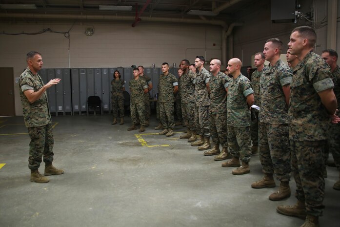 Brig. Gen. Matthew Glavy visits Marines with Marine Wing Support Detachment 31 aboard Marine Corps Air Station Beaufort, S.C., Oct. 14, 2016. Glavy visited the air station to assess the effects of Hurricane Matthew and attend the Marine Fighter Attack Squadron 122 change of command ceremony. Glavy issued the Navy and Marine Corps Achievement Medal to Capt. Seve Aguinaga and commended all the Marines there for their tremendous efforts in preparing and responding to the storm, noting they “were fighting outside of their weight class” after conducting operations normally expected of larger support squadrons to minimize impacts of the hurricane. (U.S. Marine Corps photos by Lance Cpl. Mackenzie Gibson/Released)