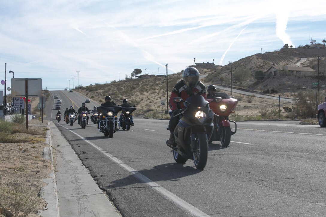 Riders taking part in the 3rd Annual Domestic Violence Awareness Poker Run Motorcycle Ride head down Highway 62 as part of Domestic Violence Awareness Month, Oct. 7, 2016. (Official Marine Corps photo by Cpl. Thomas Mudd/Released)
