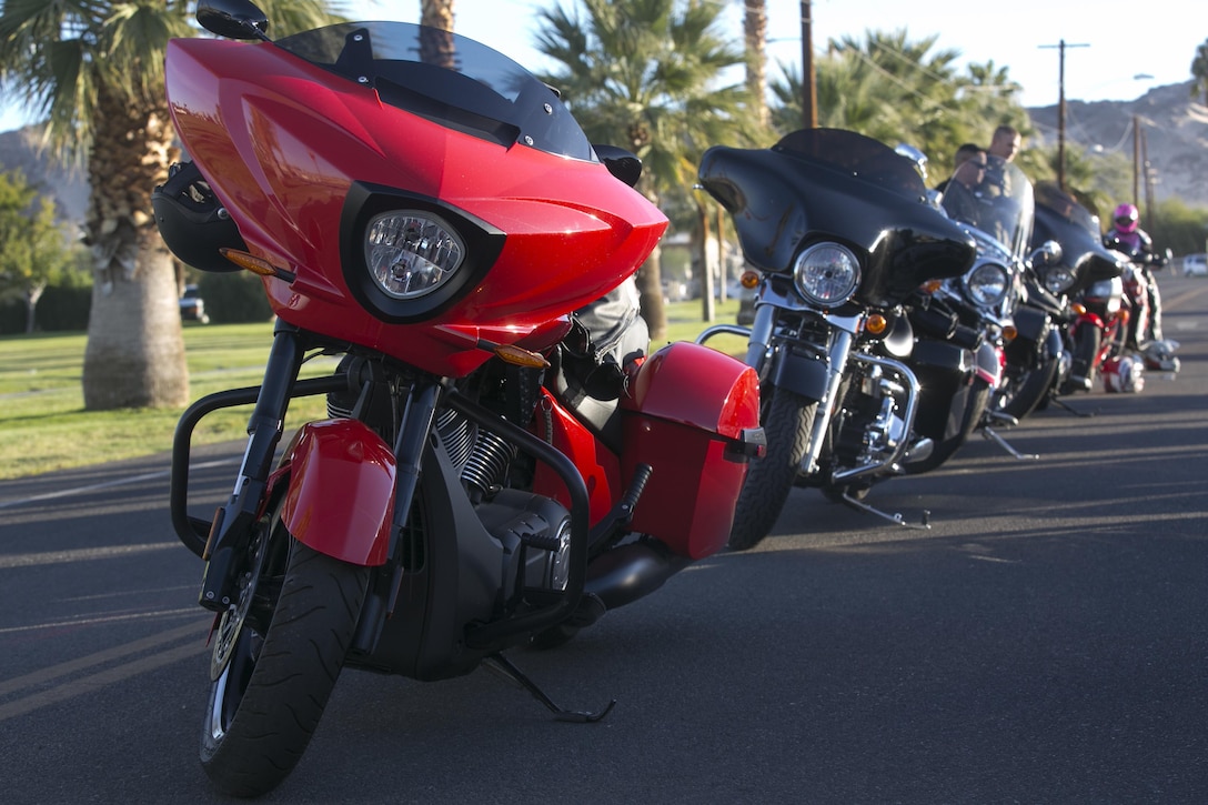Combat Center Motorcycle riders line up their vehicles before the start of the 3rd Annual Domestic Violence Awareness Poker Run Motorcycle Ride at the Protestant Chapel aboard the Marine Corps Air Ground Combat Center, Twentynine Palms, Calif., Oct. 7, 2016. (Official Marine Corps photo by Cpl. Thomas Mudd/Released)