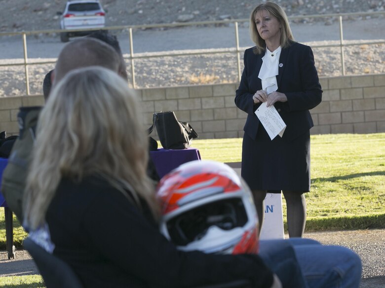 Michelle Bergey, deputy district attorney, San Bernardino County, talks about domestic violence to the participants of the 3rd Annual Domestic Violence Awareness Poker Run Motorcycle Ride at the Protestant Chapel aboard Marine Corps Air Ground Combat Center, Twentynine Palms, Calif., Oct. 7, 2016. (Official Marine Corps photo by Cpl. Thomas Mudd/Released)