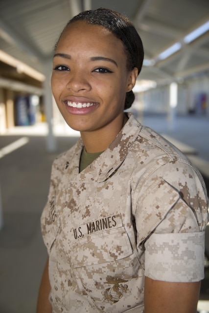 Lance Cpl. Tiana Sayles, administration clerk, Headquarters Battalion, volunteers as the assistant coach for a youth soccer team on base. (Official Marine Corps photo by Lance Cpl. Dave Flores/Released)