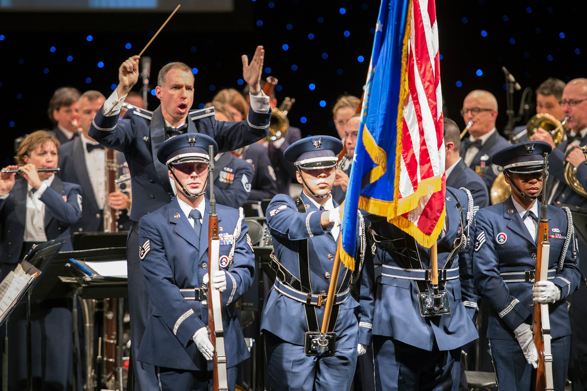 Members of the Grissom Base Honor Guard present the Colors during a concert performed by The U.S. Air Force Band of Mid-America in Logansport, Ind. Oct. 11, 2016. The honor guard routinely participates in events throughout Indiana, honoring the flag and veterans as they represent the Department of the Air Force and Grissom. (U.S. Air Force photo/Tech. Sgt. Benjamin Mota)