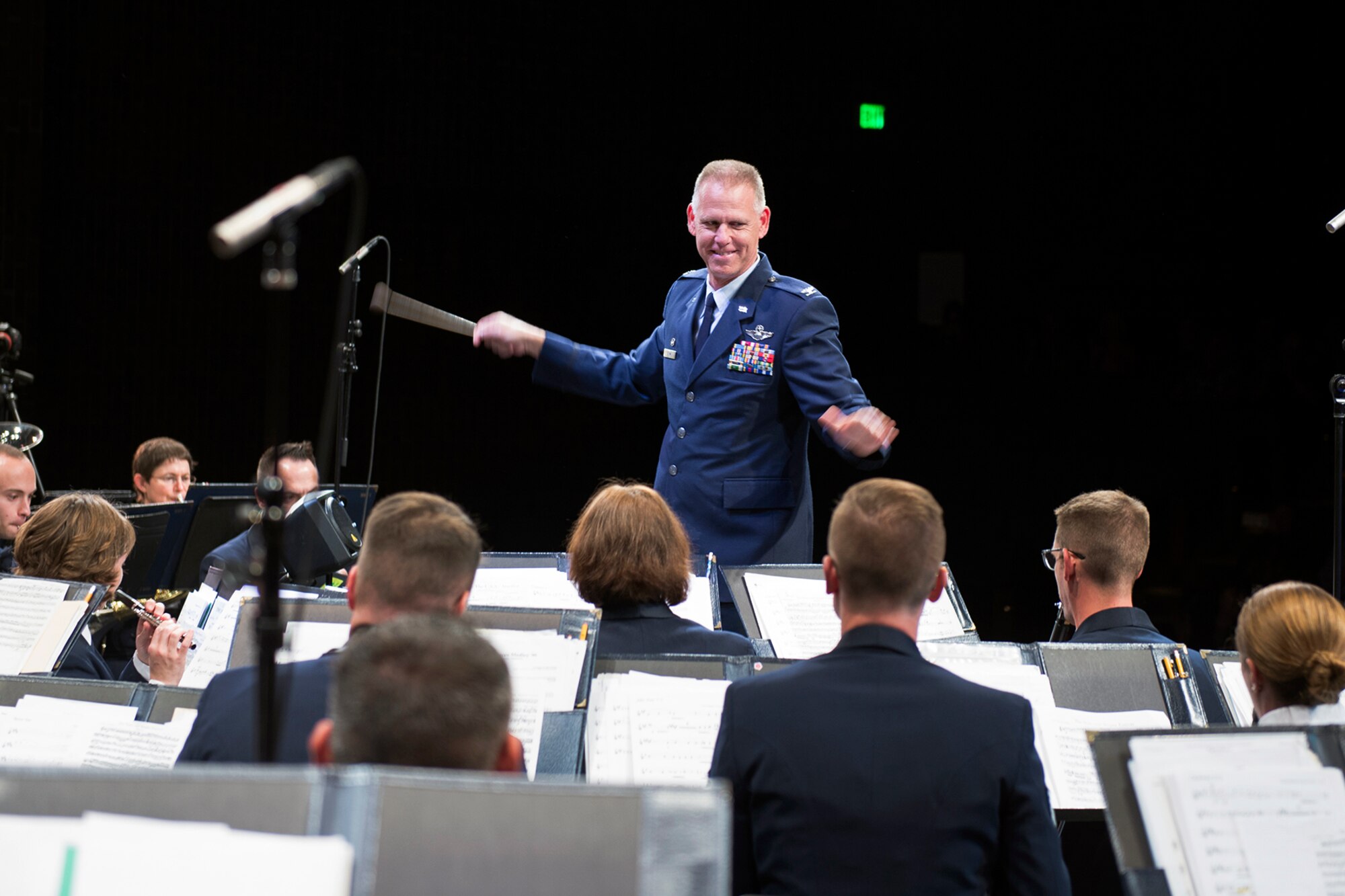 Col. Larry Shaw, 434th Air Refueling Wing commander, leads The U.S. Air Force Band of Mid-America during a concert in Logansport, Ind. Oct. 11, 2016. During the last performance of the show, Shaw was named honorary band conductor and given the commander’s baton to finish out the concert. (U.S. Air Force photo/Tech. Sgt. Benjamin Mota)