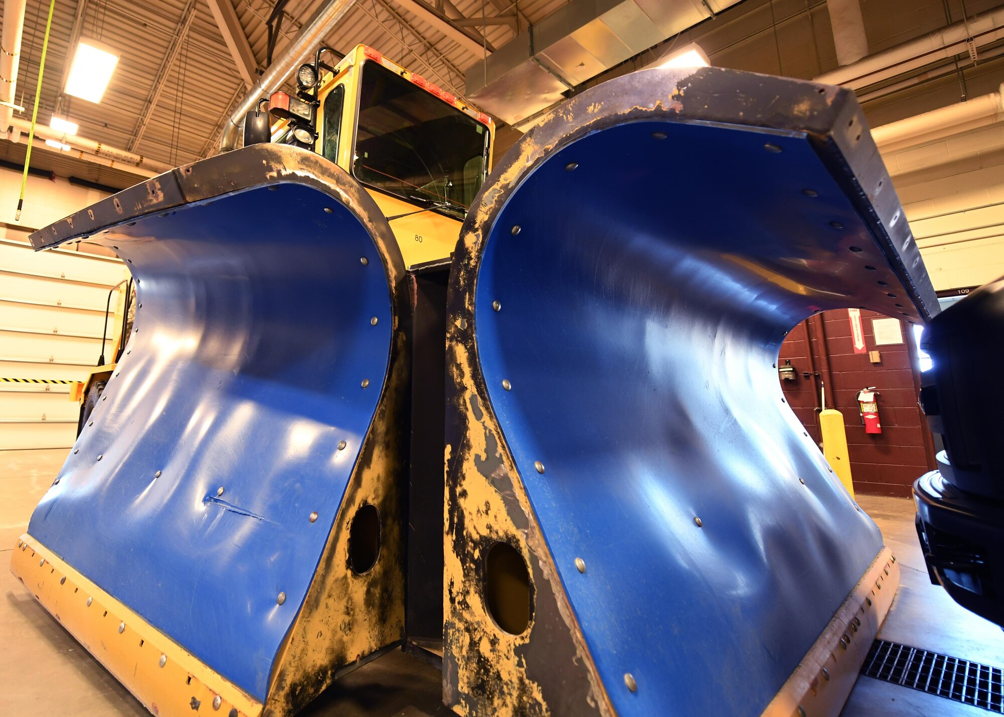 An Oshkosh 26’ Snow Plow awaits routine maintenance Oct. 13, 2016, on Grand Forks Air Force Base, N.D. Snow removal vehicles are relied upon heavily during the harsh North Dakota winter and are a constant challenge for the 319th Logistics Readiness Squadron vehicle maintenance flight. (U.S. Air Force photo by Senior Airman Ryan Sparks/Released)