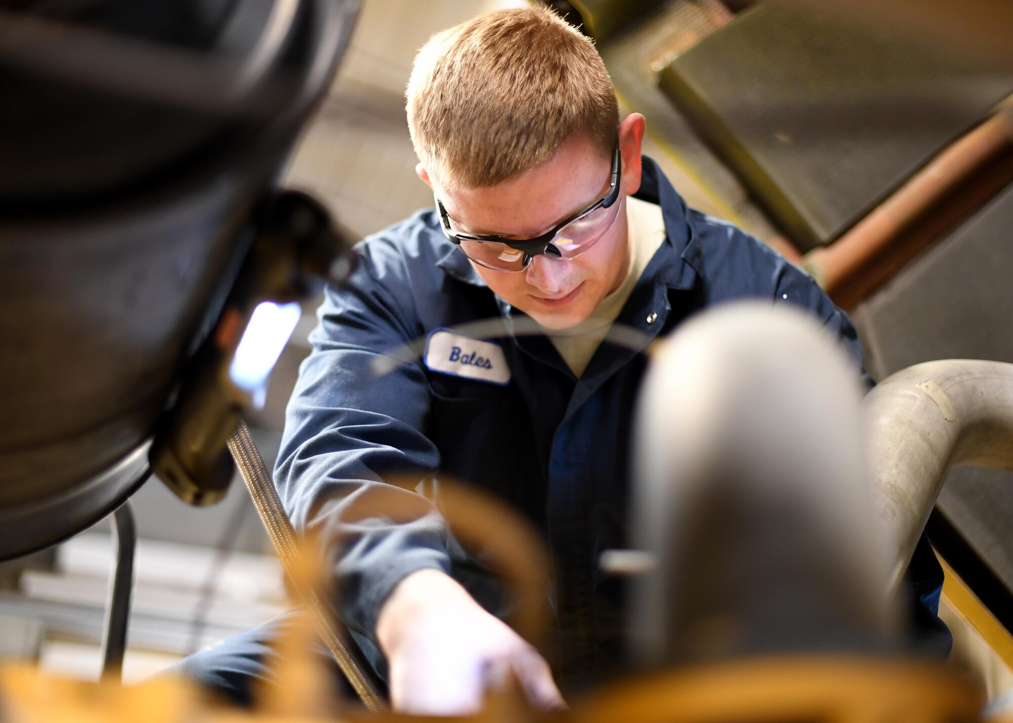 Senior Airman Robert Bales, 319th Logistics Readiness Squadron vehicle maintenance journeyman, performs routine maintenance on an Oshkosh 26’ Snow Plow Oct. 13, 2016, on Grand Forks Air Force Base, N.D. The 319th LRS spends months preparing vehicles for the harsh winter conditions in North Dakota. (U.S. Air Force photo by Senior Airman Ryan Sparks/Released)