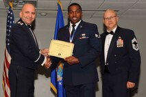 U.S. Air Force Reserve Lt. Col. Paul Centinaro, commander of the 913th Maintenance Squadron, Senior Airman Corey Malone, a maintenance management production journeyman assigned to the 913 MXS and Chief Master Sgt. Paul Stewart, the superintendent for the 913th Airlift Group, pose for a photo during the Airman Leadership School graduation ceremony at Little Rock Air Force Base, Ark., Oct. 13, 2016. ALS is an Air Force education program held at base level to prepare senior Airmen for positions of greater responsibility. The course teaches leadership skills required of supervisors and reporting officials throughout the Air Force. (U.S. Air Force photo by Senior Airman Stephanie Serrano)