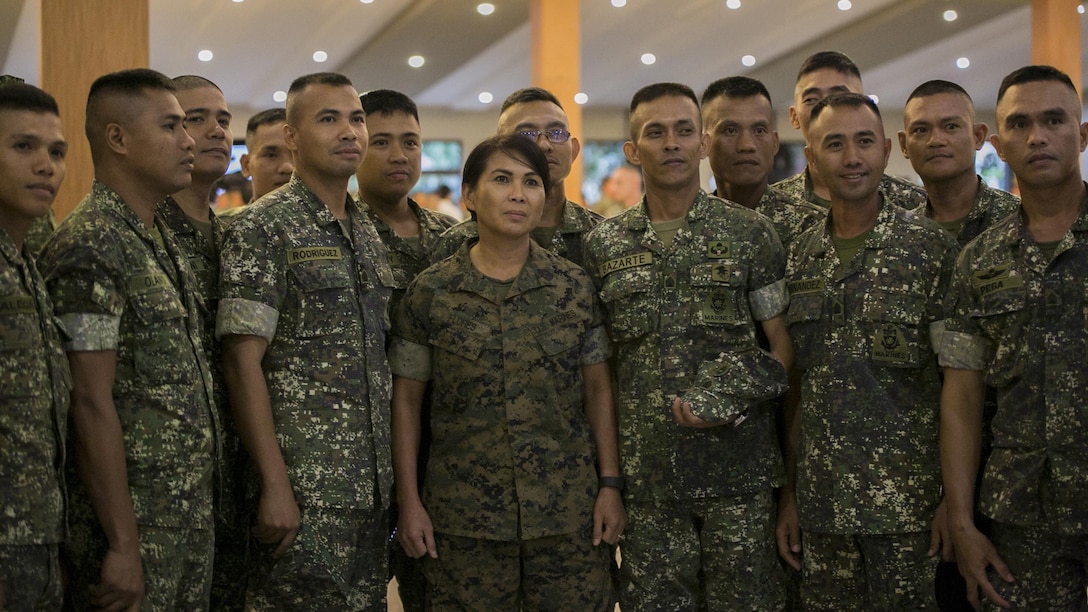 U.S. and Philippine Marines pose for a photo at the end of the Philippine Amphibious Landing Exercise 33 closing ceremony at Marine Barracks Rudiardo Brown, Taguig City, Philippines, Oct. 11, 2016. PHIBLEX is an annual U.S.-Philippine military bilateral exercise that combines amphibious capabilities and live-fire training with humanitarian civic assistance efforts to strengthen interoperability and working relationships.