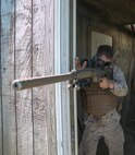 Lance Cpl. Cody Oxby, Company A, Fleet Anti-Terrorism Security Team, Marine Corps Security Force Regiment, positions himself for an advanced shooting technique with the M110 Semi-Automatic Sniper System during designated marksman sustainment training aboard Naval Air Station Oceana Dam Neck, Va., Oct. 12, 2016. The six designated marksmen from 6th platoon, Company A, FAST, act as the guardian angels for the platoon, utilizing the M110 SASS to provide security at greater distances, protect assets, embassies and take precision shots. (Official U.S. Marine Corps photo by Sgt. Calvin Shamoon/ Released)