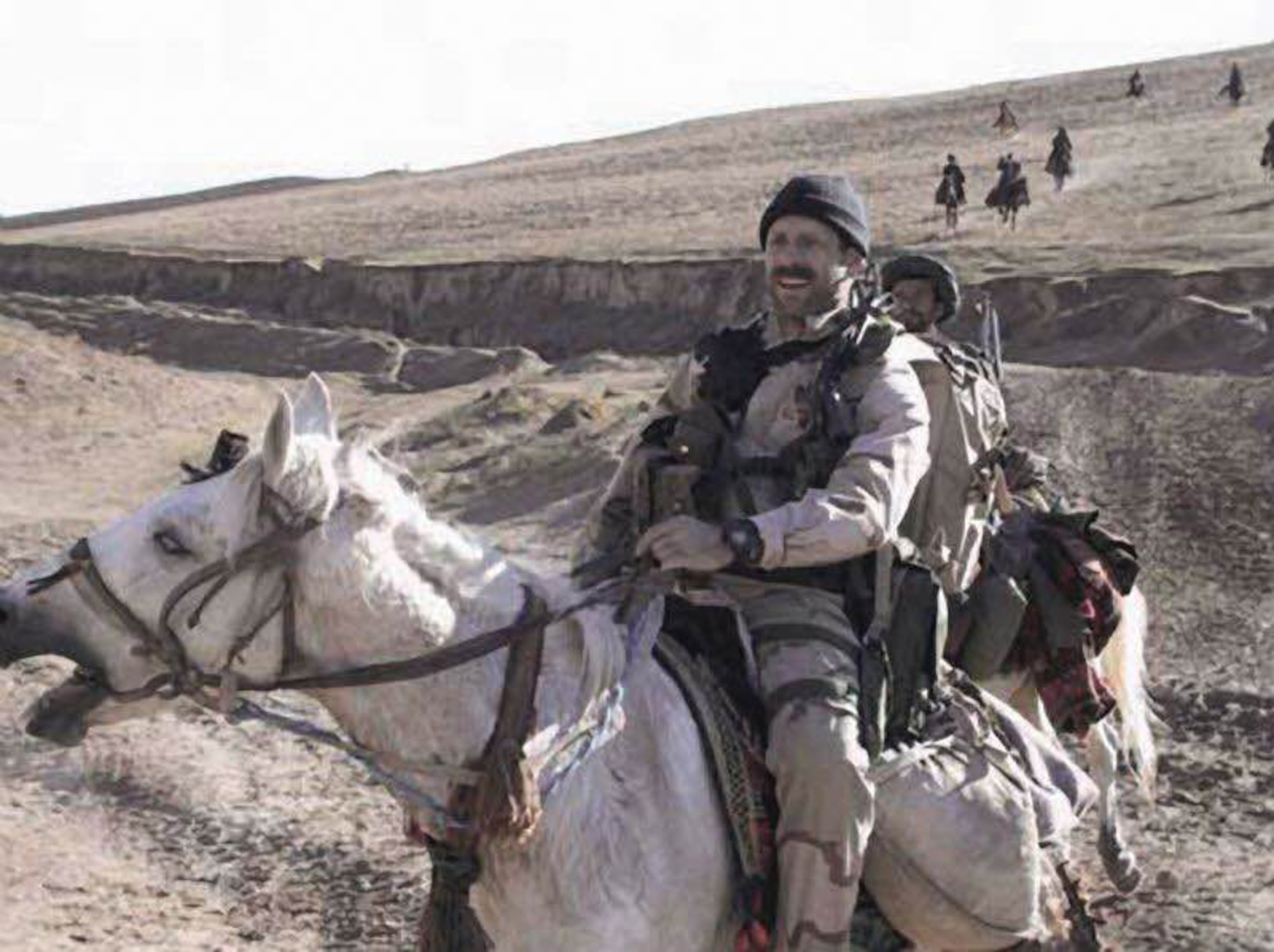 Master Sgt. Bart Decker and other Airmen used unconventional methods of transportation during Afghanistan operations.  Riding horses along with Northern Alliance forces provided an interface between ground forces and air power. (Courtesy photo)