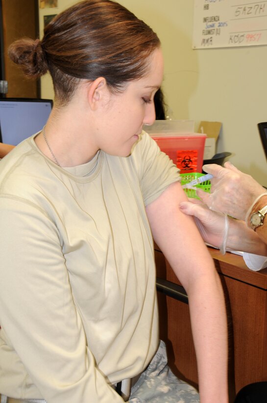 Spc. Siobhan Nagy, a chemical, biological, radiological and nuclear specialist from Keyport, New Jersey, assigned to the U.S. Army Reserve's 357th Chemical Company, receives an immunization during a 99th Regional Support Command-sponsored mass medical event Oct. 14 at Joint Base McGuire-Dix-Lakehurst, New Jersey.  For more information about MMEs, contact the 99th RSC's Surgeons Office at (609) 562-7455.