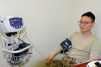 Spc. Ho Sung Kim, a combat medic from Seoul, South Korea, assigned to the U.S. Army Reserve's 357th Chemical Company, has his blood pressure checked during a 99th Regional Support Command-sponsored mass medical event Oct. 14 at Joint Base McGuire-Dix-Lakehurst, New Jersey.  For more information about MMEs, contact the 99th RSC's Surgeons Office at (609) 562-7455.