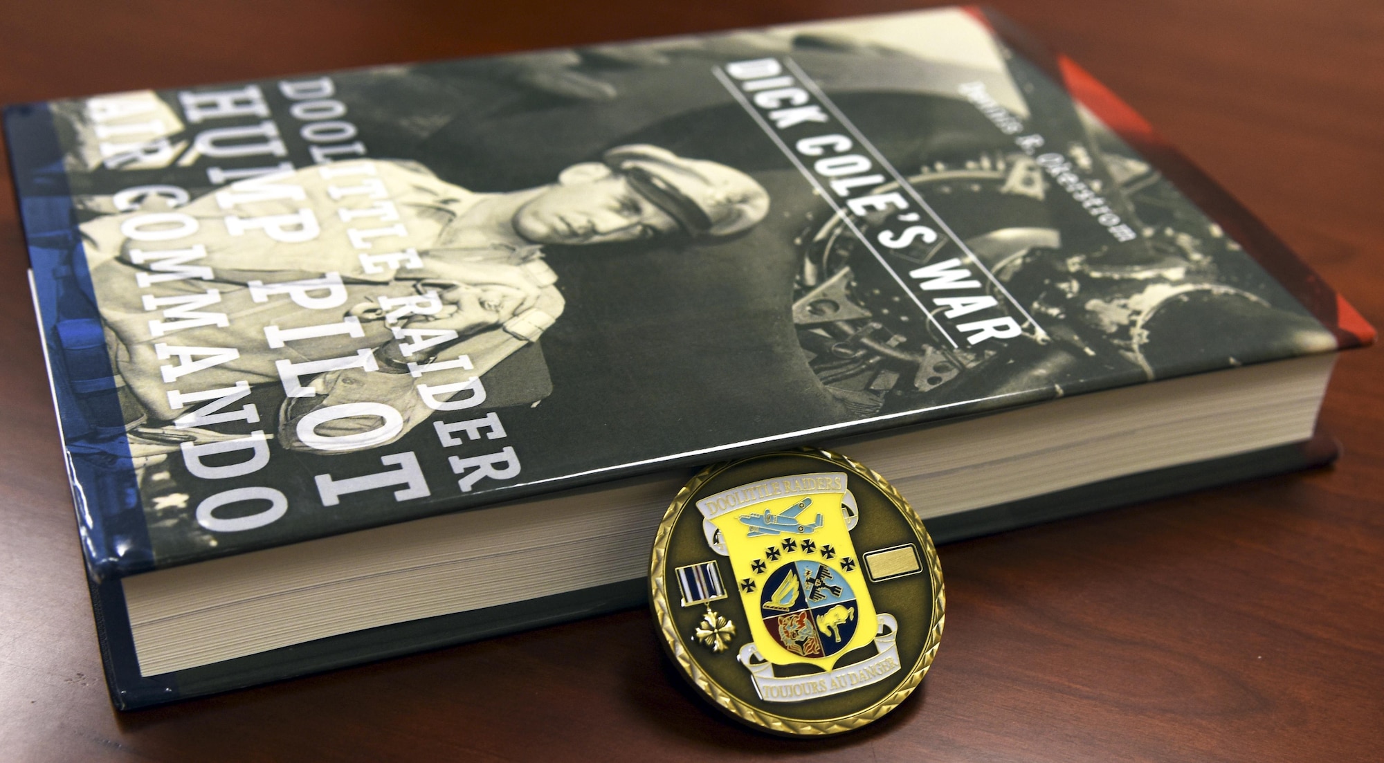 Retired Lt. Col. Richard Cole, the last remaining Doolittle Raider, gave the 337th Test and Evaluation Squadron a Doolittle Raider coin and book as a token of appreciation for naming the Air Force's newest bomber in their honor. Cole was invited to the naming ceremony last month when the Air Force introduced the bomber as the B-21 Raider. (Courtesy photo)
