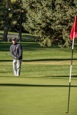 Wade Robinson chips during the annual Fire Prevention Golf Tournament Oct. 6 at the Hubbard Golf Course. The tournament hosted by the Hill Firefighters Association and raised money for Fire Prevention Week and the Hill Field Elementary School Firefighter-for-a-Day program. (U.S. Air Force photo by Paul Holcomb) 