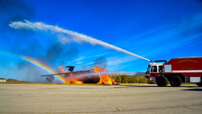 A Hill Air Force Base fire truck sprays a fire at the training range on base Oct. 13. The demonstration was a part of 2016 Fire Prevention Week activities. (U.S. Air Force photo by R. Nial Bradshaw)