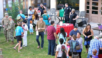 Joint Base San Antonio-Fort Sam Houston residents check out some of the activities offered during the National Night Out celebration at the Lincoln Family Housing headquarters at 2739 Dickman Drive at JBSA-Fort Sam Houston Oct. 4. Activities included prize giveaways, a display from the 4th Reconnaissance Battalion, San Antonio Police Department motorcycle display, displays by JBSA Fire Emergency Services stationed at JBSA-Fort Sam Houston, weapons and vehicle displays from the 502nd Security Forces Squadron and music by the 323rd Army Band “Fort Sam’s Own.”