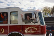 Col. Bradley Cochran, vice commander of the 28th Bomb Wing, and his family pass out candy to Ellsworth families as a part of Fire Prevention Week at Ellsworth Air Force Base, S.D., Oct. 8, 2016. The 28th Civil Engineer Squadron firefighters also hosted an open house later that day, offering Airmen and their families the chance to participate in activities and demonstrations about fire safety. (U.S. Air Force photo by Airman 1st Class Donald C. Knechtel)