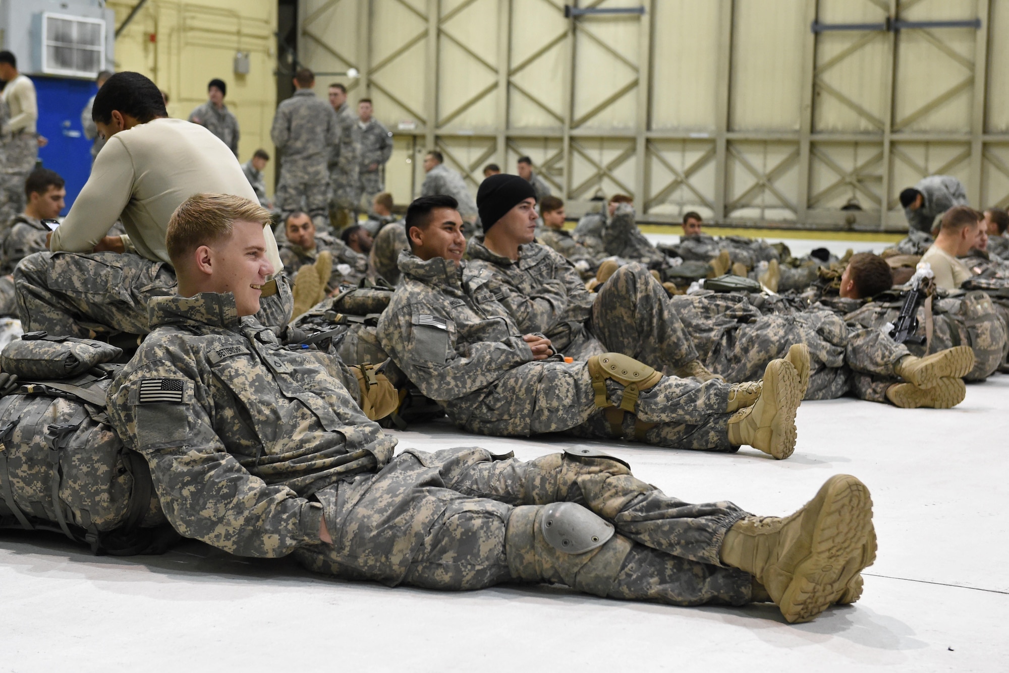 Paratroopers with the 4th Infantry Brigade Combat Team (Airborne), 25th Infantry Division, U.S. Army Alaska, gather at Hangar 1 before a jump at Joint Base Elmendorf-Richardson, Alaska, Oct. 12, 2016. The jump was part of Red Flag-Alaska 17-1, a training exercise for U.S. and international forces flown under simulated air combat conditions. 