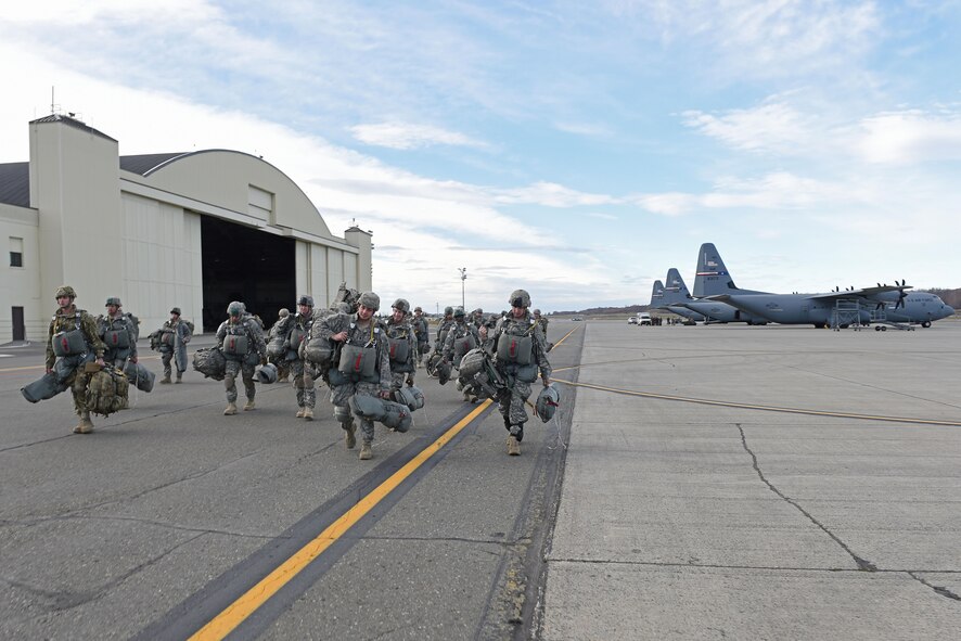 Paratroopers with the 4th Infantry Brigade Combat Team (Airborne), 25th Infantry Division, U.S. Army Alaska, prepare to board a Royal New Zealand Air Force C-130 Hercules during Red Flag Alaska 17-1 at Joint Base Elmendorf-Richardson, Alaska, Oct. 12, 2016. Red Flag-Alaska exercises are focused on improving the combat readiness of U.S. and international forces and providing training for units preparing for Air Expeditionary Force taskings. 