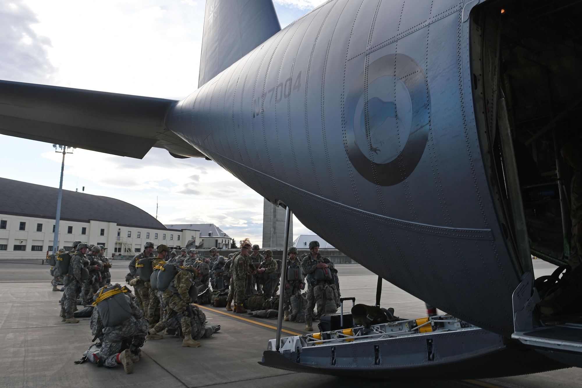 Paratroopers with the 4th Infantry Brigade Combat Team (Airborne), 25th Infantry Division, U.S. Army Alaska, prepare to board a Royal New Zealand Air Force C-130 Hercules during Red Flag Alaska 17-1 at Joint Base Elmendorf-Richardson, Alaska, Oct. 12, 2016. Red Flag-Alaska exercises are focused on improving the combat readiness of U.S. and international forces and providing training for units preparing for Air Expeditionary Force taskings. 